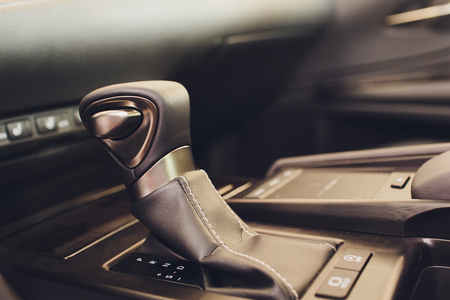 Detail of modern car interior, gear stick, automatic transmission in expensive car