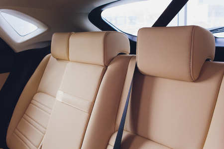Luxury car inside. Interior of prestige modern car. Comfortable leather seats. Black perforarated leather cockpitの写真素材