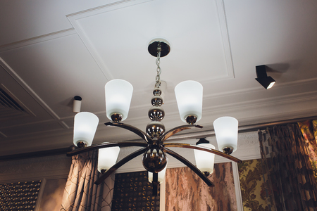 luxury expensive chandelier hanging under ceiling in palace.の写真素材