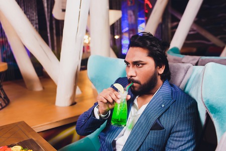 Two Man In Bar Hold Glasses Sit At Counter, Drinking cocktail, Cheerful Friends Meeting Bar...