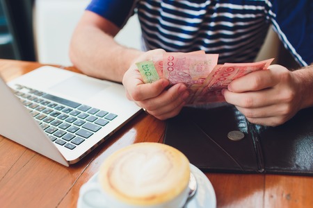 man paying bill in cafe. He putting money. Busy man having lunch in restaurant. service concept.
