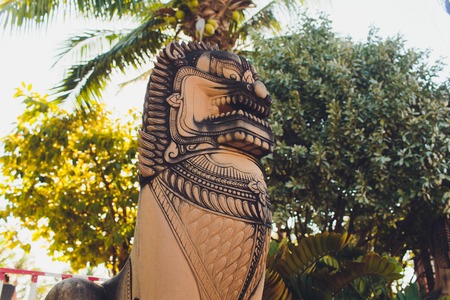 The lion statue in a buddhist temple in Phuket, Thailand.の写真素材
