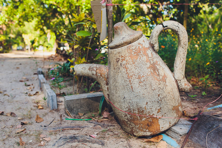 Old clay jug to make a butter from milk. Old pot.の写真素材