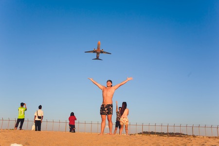 BANGKOK, THAILAND- 25 October 2018 : Ant eye view of Airasia take off on sky position in bottom left corner.のeditorial素材