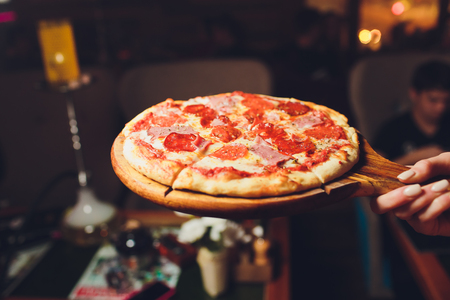 Top view tasty italian pizza on dark background.の写真素材