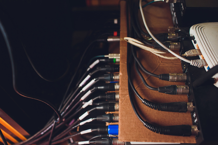 Audio jack cable connected at rear end of mixer at broadcasting,shallow depth of field.の写真素材