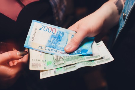 mens hands count the Russian money close up.の写真素材