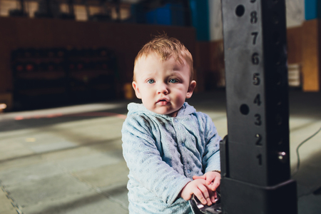 Woman as a therapist at physiotherapy and sports with child in gym.の写真素材
