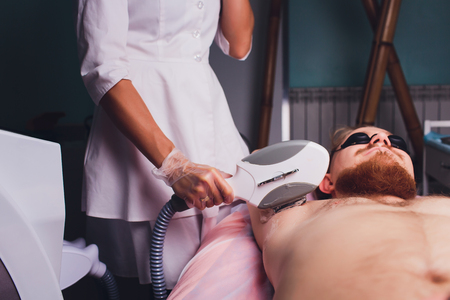 Young Woman Having Underarm Laser Hair Removal Treatment In Beauty Spa Clinic.の写真素材