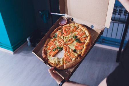 pizza slice in the in delivery box you can put your writing on the box.の写真素材