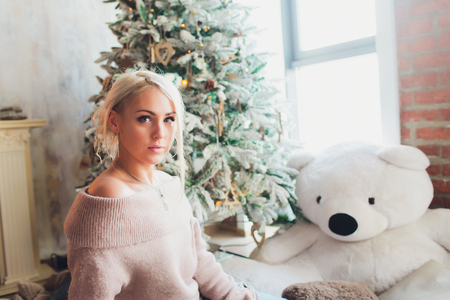 Beautiful woman with long straight blond hair. Fashion model posing at studio.の写真素材