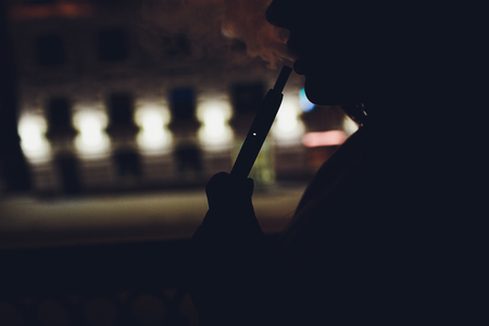New design. Showcase with a large multi-colored selection System of heating of tobacco. Color devices for smoking. New technology of electronic cigarettes. heating of tobacco.の写真素材