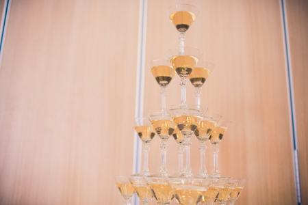 Champagne glasses standing in a tower at the party.の写真素材