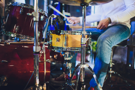 Drums conceptual image. Picture of drums and drumsticks lying on snare drum.の写真素材