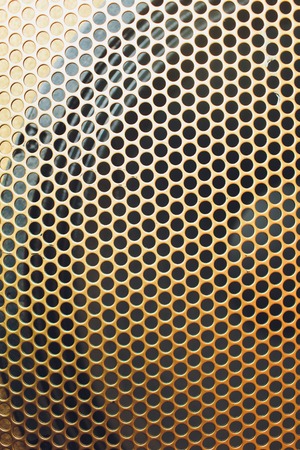 Musical powerful speaker with a protective grill close-up.の写真素材