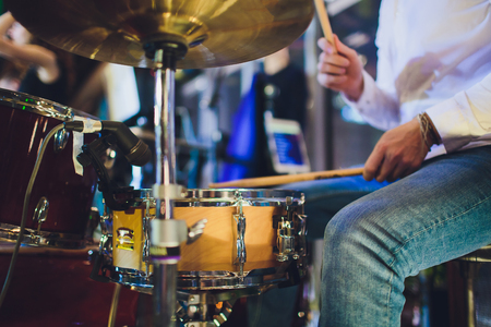 Drums conceptual image. Picture of drums and drumsticks lying on snare drum.の写真素材