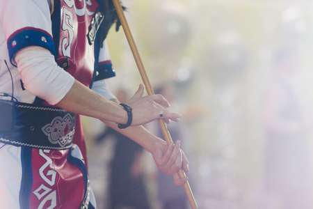 Man in national costume play national music instrument. kurai.の写真素材