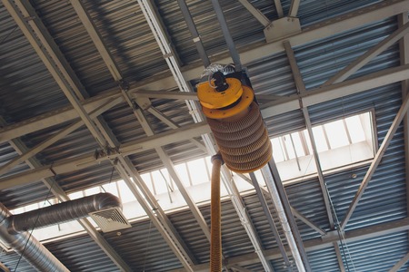 The device for removing exhaust gases in the car repair shop. Car service equipment. Ventilation. Vehicle Exhaust Removal Systems.の写真素材