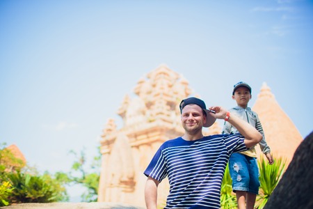 Caucasian man cap Vietnam wat temple on backgroundの写真素材