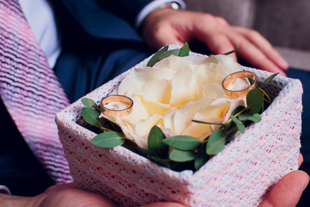 the bride is holding a bouquet of the bride from white roses and eustoma.の写真素材