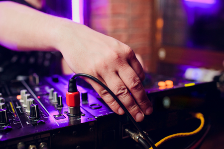 DJ playing music mixer closeupの写真素材