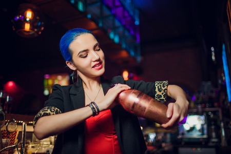 girl bartender makes a cocktailの写真素材