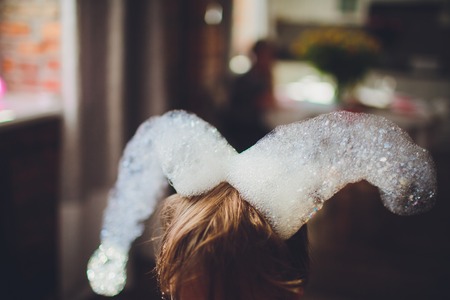 soap bubbles on the childs headの写真素材
