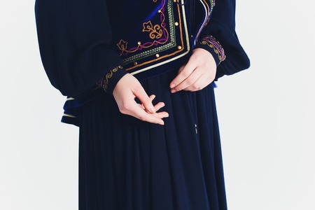 national Bashkir costumes. peoples of Russia. Tatars on white background studio.