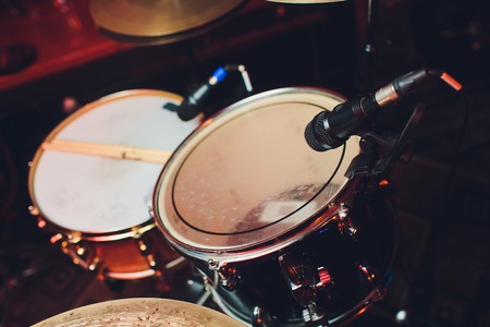 Drum kit on stage in the spotlight color.