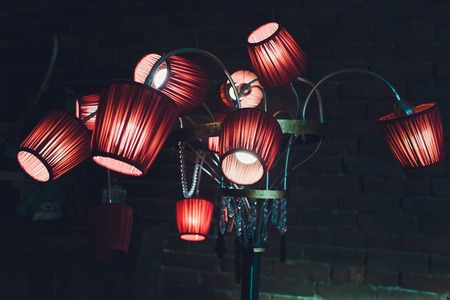 Red brown ceiling with adorable chandelier 12 lamps.の写真素材