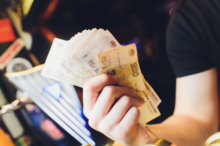 mens hands count the Russian money close up.の写真素材
