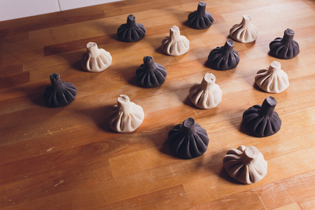 Black Georgian dumplings Khinkali with meat on white plate.の写真素材