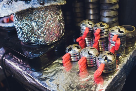 red coal for hookahs, cooking on the table.