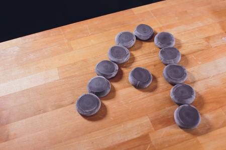 National Georgian cuisine Khinkali. Senior woman prepares khinkali. Top view raw meat dough dish uncooked. Process cooking black color.の写真素材