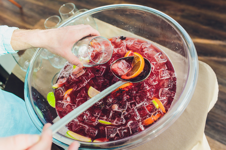 A large bottle of cold sangria with a ladle.の写真素材
