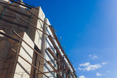 Outside renovation of a modern house, scaffolding tower.の写真素材