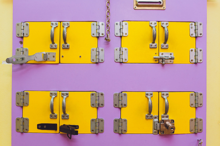 colorful busy board as best toy for kids. wooden board with zipper, Velcro, flashlight, mirror, switch, chain and beeds for small kids fingers. best toy for parrents restの写真素材