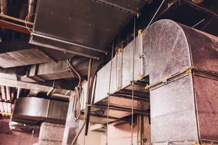 Laying of engineering networks. Ventilation pipes. Air conditioning of buildings. Pipe installation. Technical floor. Maintenance of cable networks.の写真素材