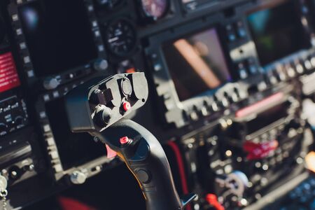 Black control panel in a helicopter cockpit.