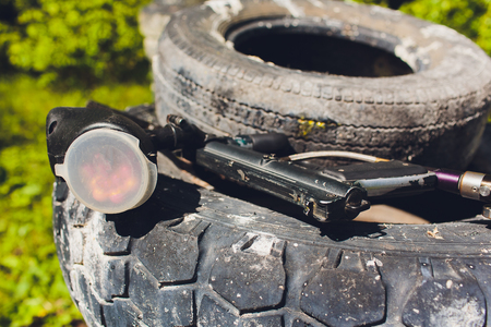 Paintball guns on a wooden table. play paintballの写真素材