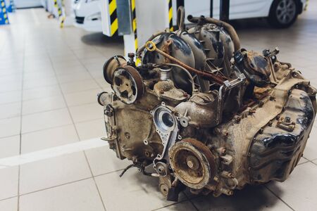 an old outdated engine, a closeup shot, engine car broken.の写真素材