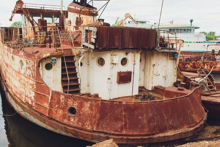 Old abandoned ship on the river bank.の写真素材