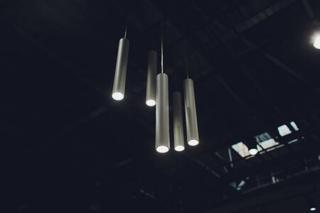 Beautiful electric chandelier on a dark background.の写真素材