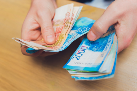 Russian rubles in the hands of a business womanの写真素材