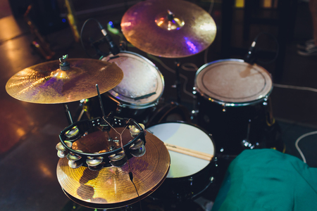 Modern drum set on stage prepared for playingの写真素材