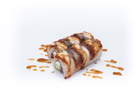 Salmon, eel, avocado and cucumber rolls isolated on white background.の写真素材