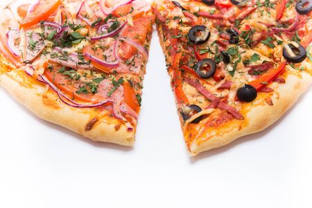 Pizza slice top view isolated on white background, with onions, bacon and cherry tomatoes, thin pastry crust, closeup.の写真素材