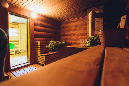 Part of the interior of the Russian bath and bath accessories. Bath accessories on the background of the log walls of the Russian bath.の写真素材