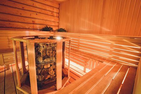 Part of the interior of the Russian bath and bath accessories. Bath accessories on the background of the log walls of the Russian bath.の写真素材
