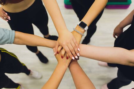 Close up of high five hand gesture, symbol of common celebration or greeting, people planning to...